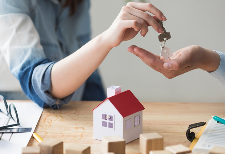 A house key is being handed over